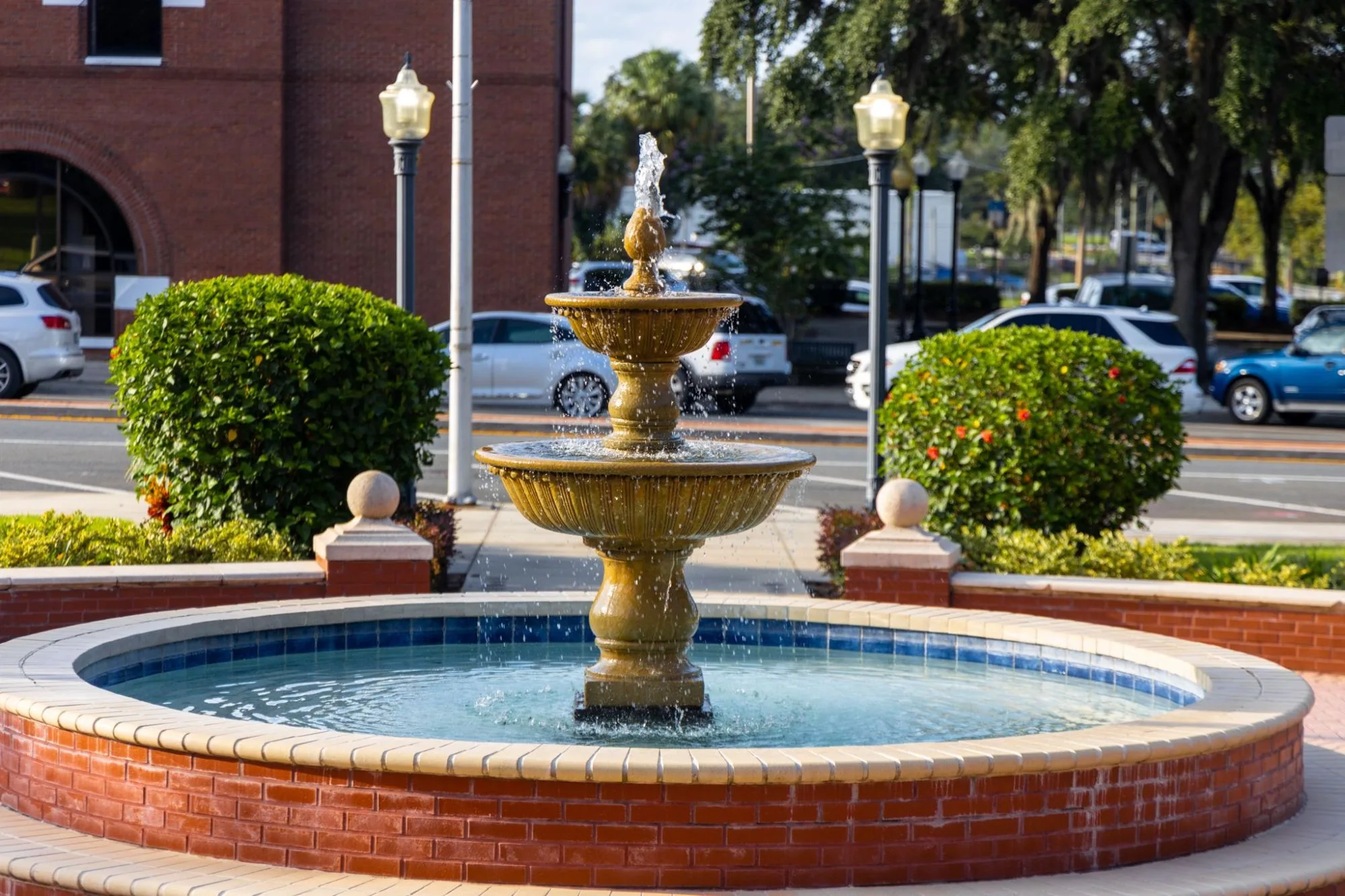 The tiered fountain on the courthouse square, with the lamp posts and 7th Street beyond.